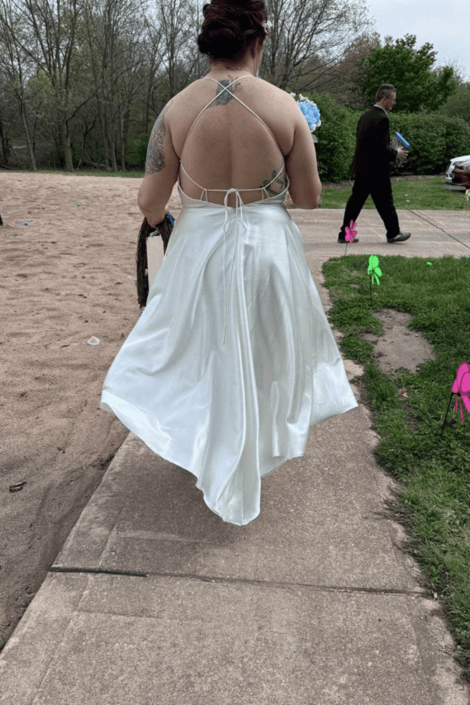 Black tie customs 2 Picture of a bride from behind with a short dress.