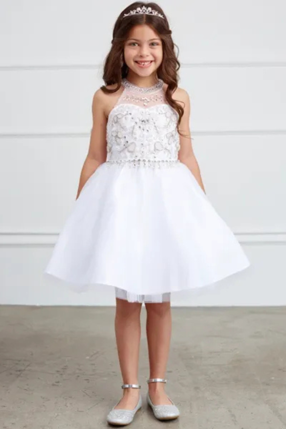 Flower Girl Dresses 3 Young girl in white flower girl dress.